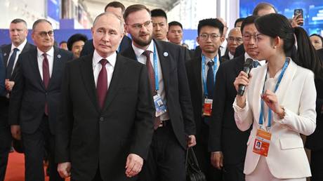 Russian President Vladimir Putin tours an exhibition of the 8th Russia-China Expo and the 4th Russia-China Forum on Interregional Cooperation in Harbin, Heilongjiang province, China.