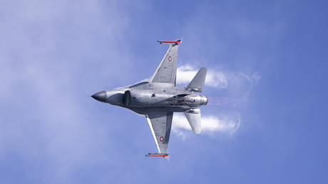 A Danish F-16 aircraft showcases some of its capabilities at a press event.