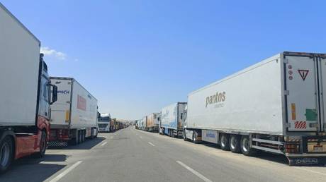 Trucks loaded with humanitarian aid are seen waiting for entry to Gaza from the Egypt's Rafah border crossing