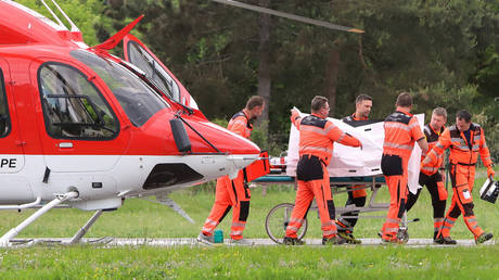 Picture taken on May 15, 2024 shows Slovak Prime Minister Robert Fico being transported from a helicopter by medics to the hospital in Banska Bystrica, Slovakia where he is to be treated after he had been shot 'multiple times'.
