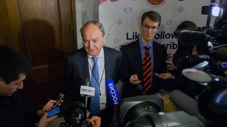 Russian Ambassador to the US Anatoly Antonov speaks to journalists during the Russian presidential election at a polling station at the Russian Embassy in Washington.