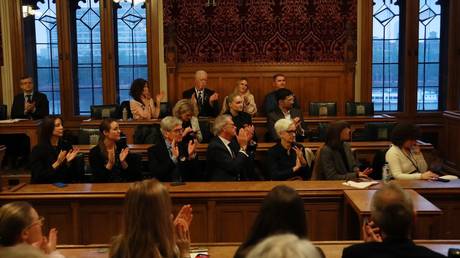 British MPs clap for members of Ukraine's neo-Nazi 'Azov' brigade in London, May 22, 2024.