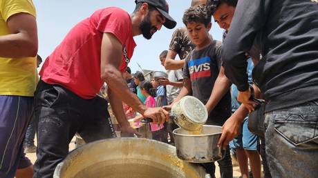 FILE PHOTO: Food being distributed by charities in Rafah, Gaza.