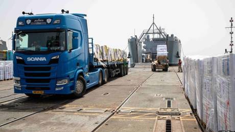 An aid truck arrives at a temporary pier built by the US military on the Gaza Strip's coast.