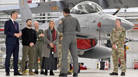 Belgium's PM Alexander De Croo, Ukrainian leader Vladimir Zelensky and Belgium's Defence Minister Ludivine Dedonder meet with Belgian F-16 pilots.