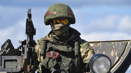FILE PHOTO: A reconnaissance group serviceman of Russian Armed Forces Eastern Military District is seen in a vehicle moving on Kharkiv direction during the special military operation in Ukraine.