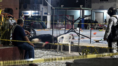 A member of the National Guard custodies the crime scene of the mayoral candidate of the opposition, Alfredo Cabrera, murdered during his electoral campaign closure in Las Lomas, Guerrero, Mexico on May 29, 2024.