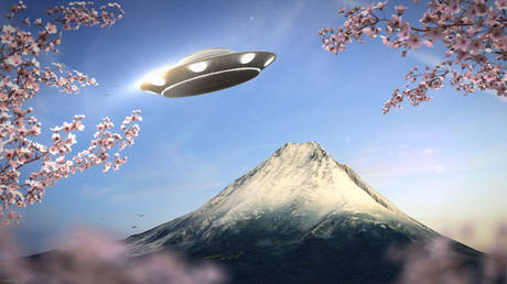 A 3D rendering of UFO flying above Mount Fuji in Japan.