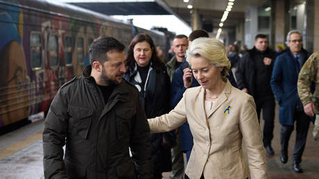 FILE PHOTO: Vladimir Zelensky (L) greets EU Commission President Ursula von der Leyen (R) at a railway station in Kiev