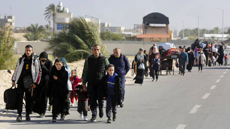 FILE PHOTO: Palestinians leave their homes in Khan Yunis and migrate to safe areas.