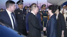 Putin arrives in China