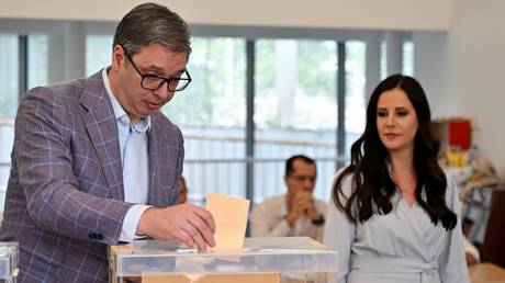 Serbian President Aleksandar Vucic casts his ballot during local elections in Belgrade.