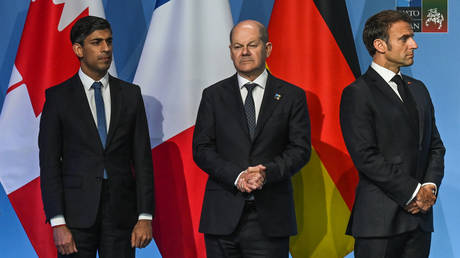 FILE PHOTO: (L-R) British Prime Minister Rishi Sunak, German Chancellor Olaf Scholz, French President Emmanuel Macron.