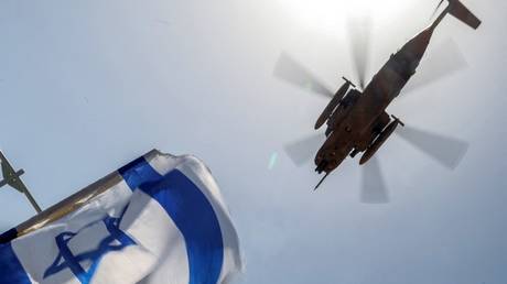 An Israeli air force CH-53 Sea Stallion military helicopter flies over Sheba Tel-HaShomer Medical Centre in Ramat Gan, Israel, June 8, 2024