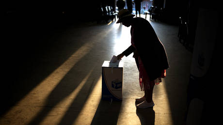 A woman casts her ballot at a polling station, during general elections in Eshowe, South Africa, on May 29, 2024.