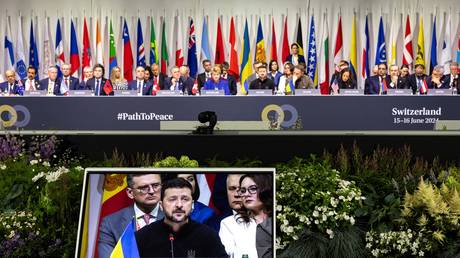 Vladimir Zelensky (screen) delivers a speech at the Summit on peace in Ukraine near Lucerne, Switzerland, on June 15, 2024
