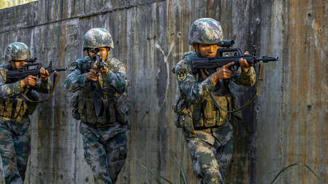 The Chinese military conduct a cross-day and all-factor live-fire red-blue confrontation drill in Zhangzhou City, Fujian Province, China, August 24, 2022.