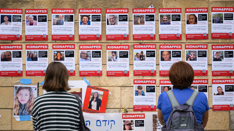 FILE PHOTO: Photographs of some of those taken hostage by Hamas during their recent attacks are seen on October 18, 2023 in Tel Aviv, Israel.