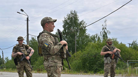 FILE PHOTO: Ukrainian border guards patrol on the closed check point.