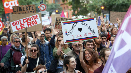 Left-wing activists in Toulouse, France, protest on Saturday against the right-wing National Rally party.