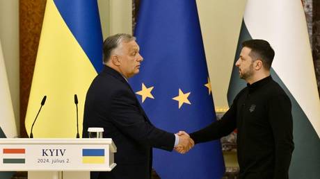 Vladimir Zelensky (R) shakes hands with Viktor Orban after delivering a press conference in Kiev, Ukraine, July 2, 2024