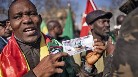 FILE PHOTO: Members of the African associations in Italy take part in a demonstration against the CFA franc in Rome, Italy, on March 02, 2019.