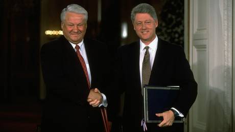 FILE PHOTO: Russian President Boris Yeltsin and US President Bill Clinton shaking hands during accord signing ceremony at the White House.