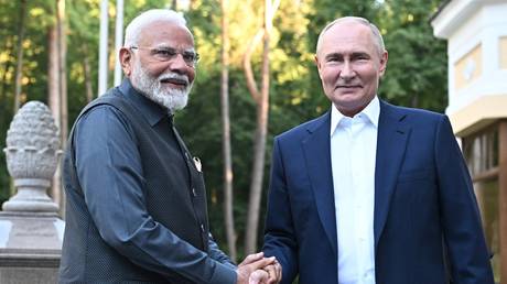 Russia's President Vladimir Putin welcomes Indian Prime Minister Narendra Modi for an informal meeting at the Novo-Ogaryovo state residence, outside Moscow, on July 8, 2024.