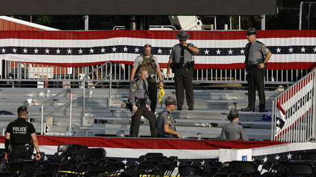 Law enforcement agents stand near the stage of a campaign rally for Republican presidential candidate former President Donald Trump on July 13, 2024 in Butler, Pennsylvania.