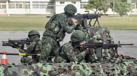 Taiwanese soldiers demonstrate their combat skills at a military base in Chiayi.