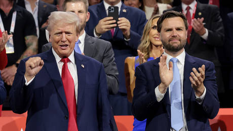 Republican presidential candidate, former U.S. President Donald Trump (L) and Republican vice presidential candidate, US Sen. JD Vance (R-OH) appear on the first day of the Republican National Convention at the Fiserv Forum on July 15, 2024 in Milwaukee, Wisconsin.