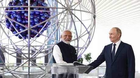 Russia's President Vladimir Putin and Indian Prime Minister Narendra Modi tour the Atom pavilion at the All-Russia Exhibition Centre (VDNH) in Moscow on July 9, 2024.