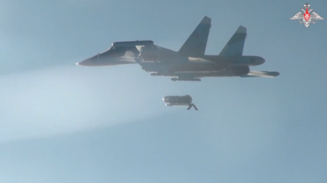 A Russian Su-34 jet deploys a FAB-3000 high-explosive bomb.