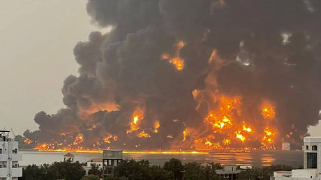 A huge column of fire erupting following strikes in the Yemeni port city of Hodeidah on July 20, 2024.