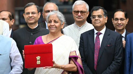 India's Finance Minister Nirmala Sitharaman (C) poses for photos before presenting the union budget in the Parliament in New Delhi on July 23, 2024.