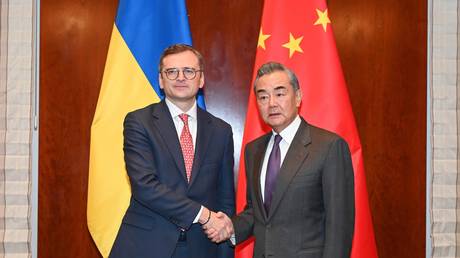 FILE PHOTO: Ukrainian Foreign Minister Dmitry Kuleba and Chinese Foreign Minister Wang Yi.