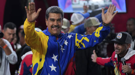 President Nicolas Maduro addresses supporters gathered outside the Miraflores presidential palace after electoral authorities declared him the winner of the presidential election in Caracas, Venezuela, Monday, July 29, 2024.