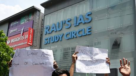 Student UPSC aspirants protest out side Rau's Study Circle against the incident of last night flooding which claims three students lives at Old Rajinder Nagar, on July 28, 2024 in New Delhi, India