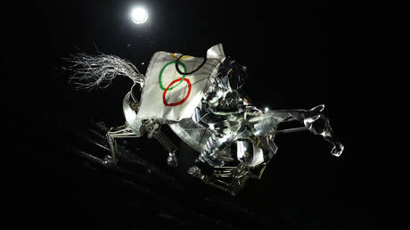 The Horsewoman, wearing the Flag of the International Olympic Committee (IOC), seen on a Metal Horse on the River Seine during the opening ceremony of the 2024 Olympic Games on July 26 in Paris.