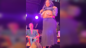 Culture minister flashes breasts (GRAPHIC VIDEO)