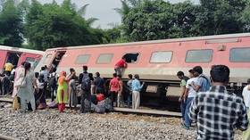 Four killed and dozens injured as 12 train coaches derailed in India