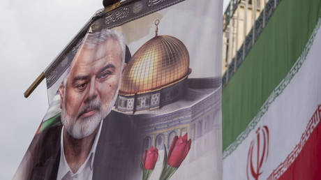 A banner with a portrait of Hamas chief Ismail Haniyeh at a funeral procession, Tehran, Iran, August 1, 2024.