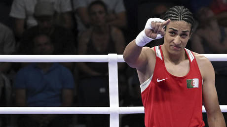 Imane Khelif of Algeria (Red) and Angela Carini of Italy (unseen) in action during their women's 66kg preliminar round of 16 bout of the Boxing competitions in the Paris 2024 Olympic Games, at the North Paris Arena in Villepinte, France, 1 August 2024 .