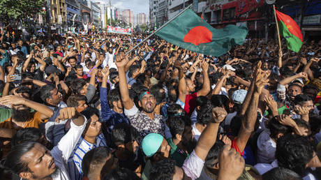 People gather in front of the Bangladesh Nationalist Party (BNP) headquarters during a rally in Dhaka, Bangladesh, Wednesday, Aug. 7, 2024.