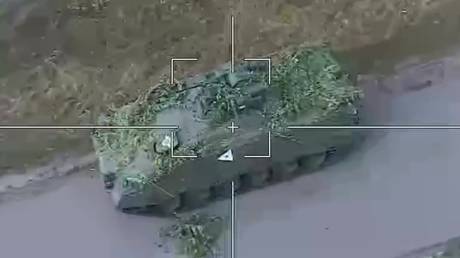 A Russian Lancet kamikaze targets a US-made Bradley infantry fighting vehicle used by Ukrainian troops in the border area of Russia's Kursk Region.