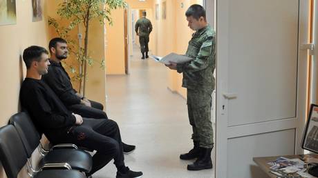 FILE PHOTO: An instructor works at a contract enlistment station in Tambov, Russia.