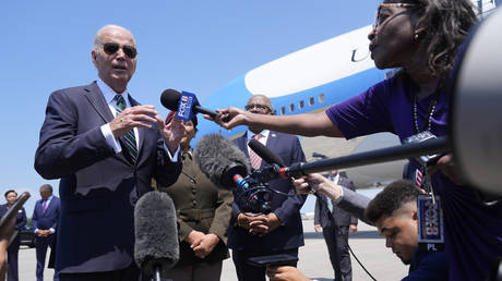 President Joe Biden talks with reporters on August 13, 2024, at Louis Armstrong International Airport in New Orleans