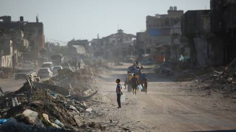 FILE PHOTO: Palestinians return to their bombed-out homes in Khan Yunis.