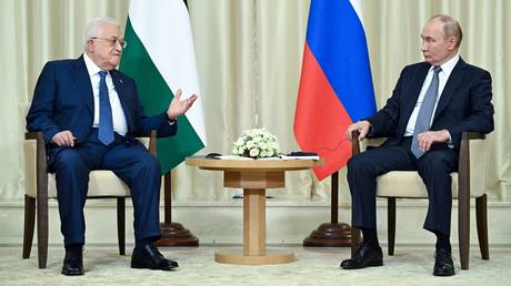 Russian President Vladimir Putin and Palestinian President Mahmoud Abbas attend a meeting at the Novo-Ogaryovo state residence, outside Moscow, Russia.