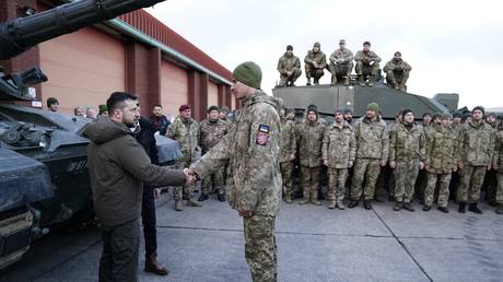 FILE PHOTO:  Vladimir Zelensky visits a British military base in February 2023, where Ukrainian troops were being trained to operate Challenger 2 tanks.